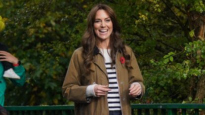 Kate Middleon wears a Breton stripe sweater and a Barbour rain jacket.