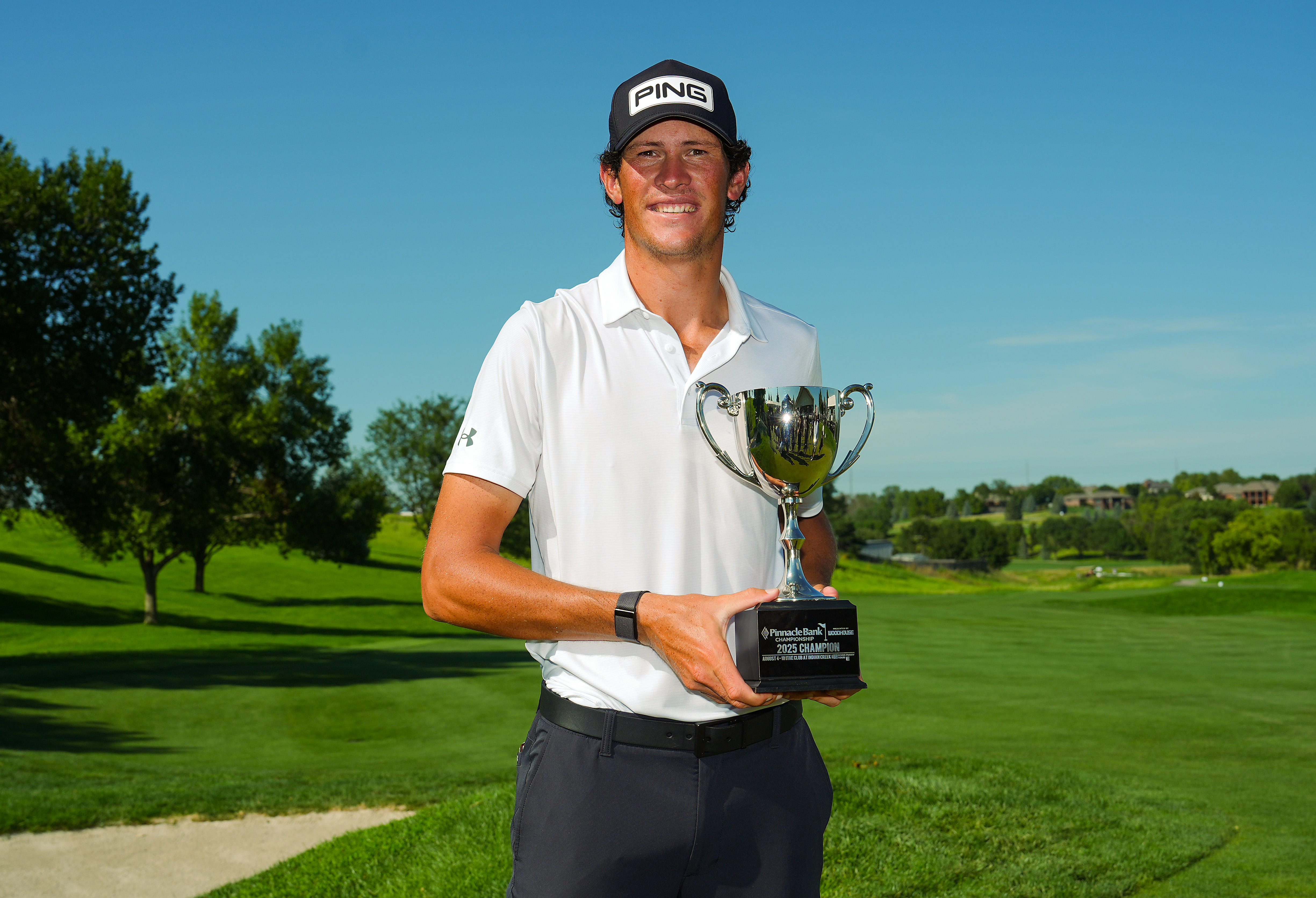 Christo Lamprecht holding a trophy