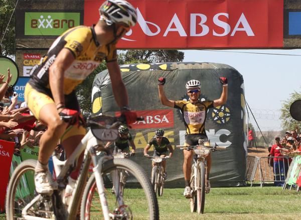 Christoph Sauser of 36One-Songo-Specialized looks back as his partner Burry Stander celebrates as they win stage 3