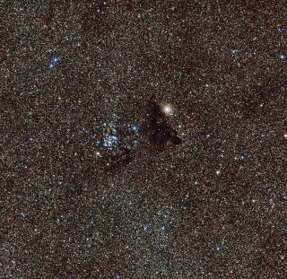 The dark nebula Barnard 86 (right) and the star cluster NGC 6520 (left) make a beautiful cosmic pairing.