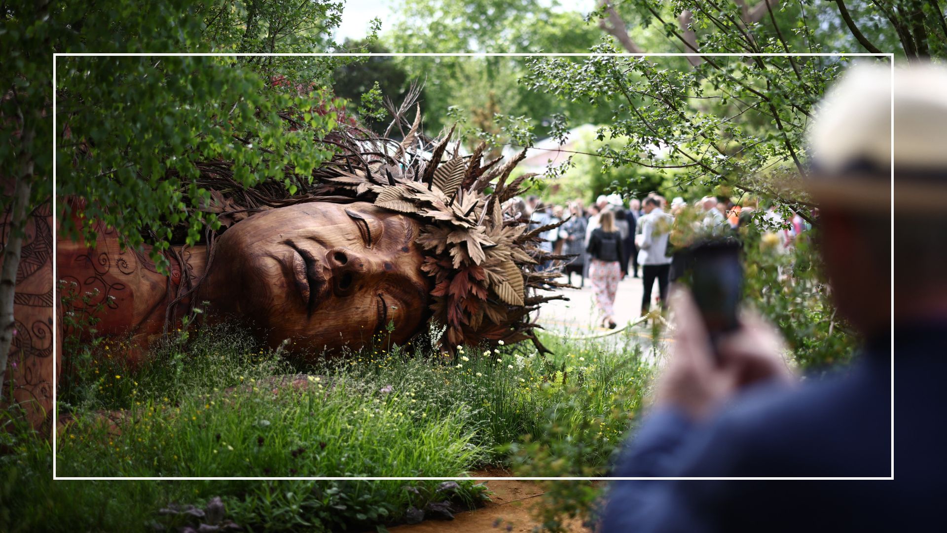 picture of A visitor takes a photo of the Gaia in The Campaign to Protect Rural England's Garden On the Edge on the press day at RHS Chelsea Flower Show
