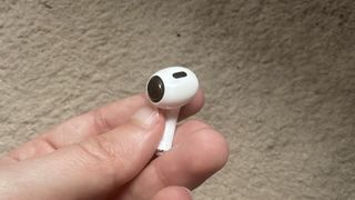 Apple AirPods Pro with the tip taken off and driver exposed.