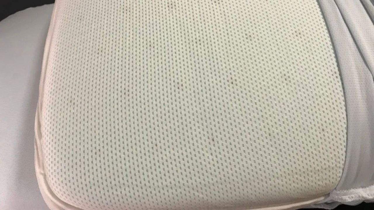 An uncovered Casper Hybrid Pillow with Snow Technology, showing its perforations