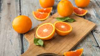 oranges on a chopping board