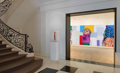 The First Floor Gallery features a triptych of portraits of signature George Condo heads