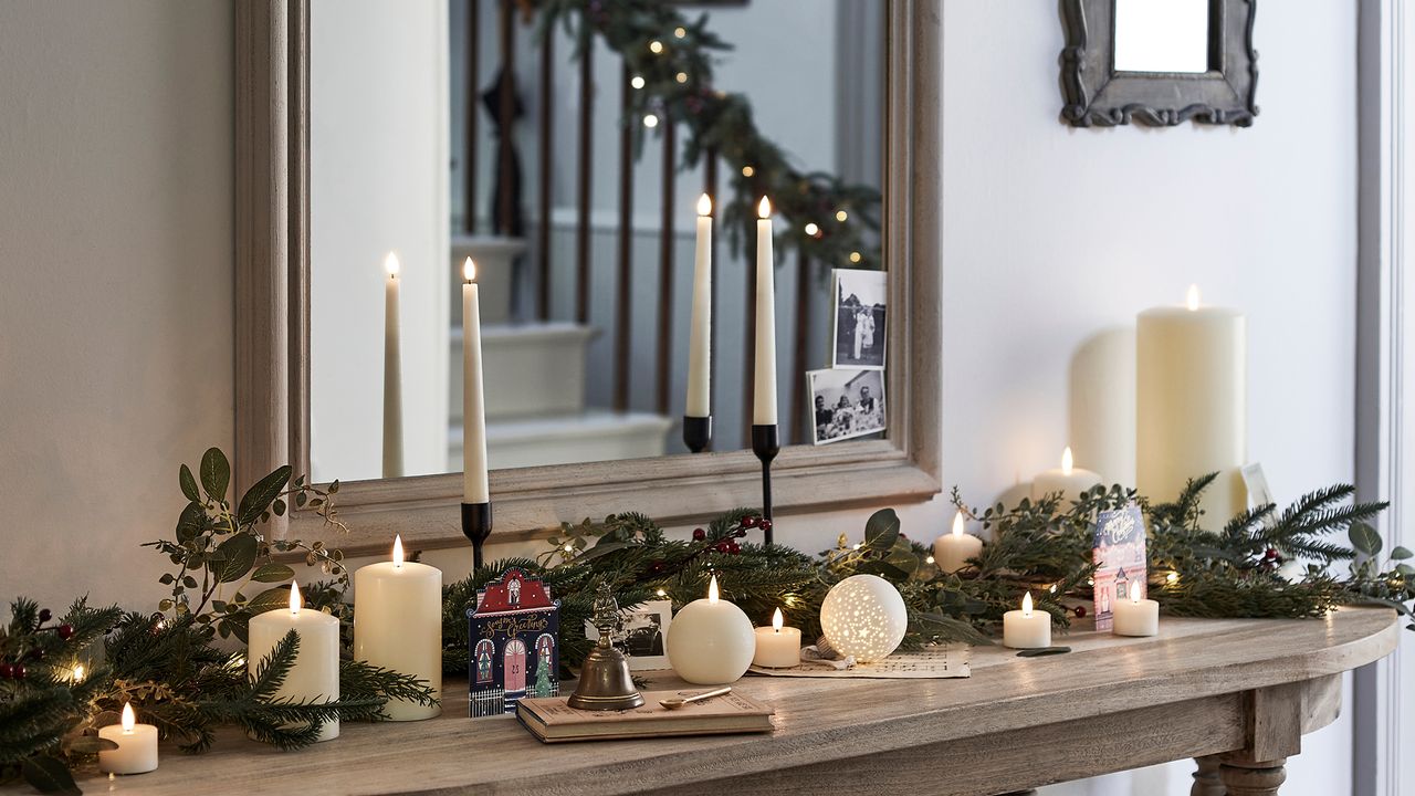 christmas greenery laying on wooden surface