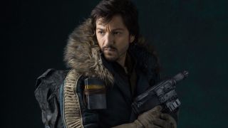 Diego Luna as Cassian Andor holding blaster in Rogue One