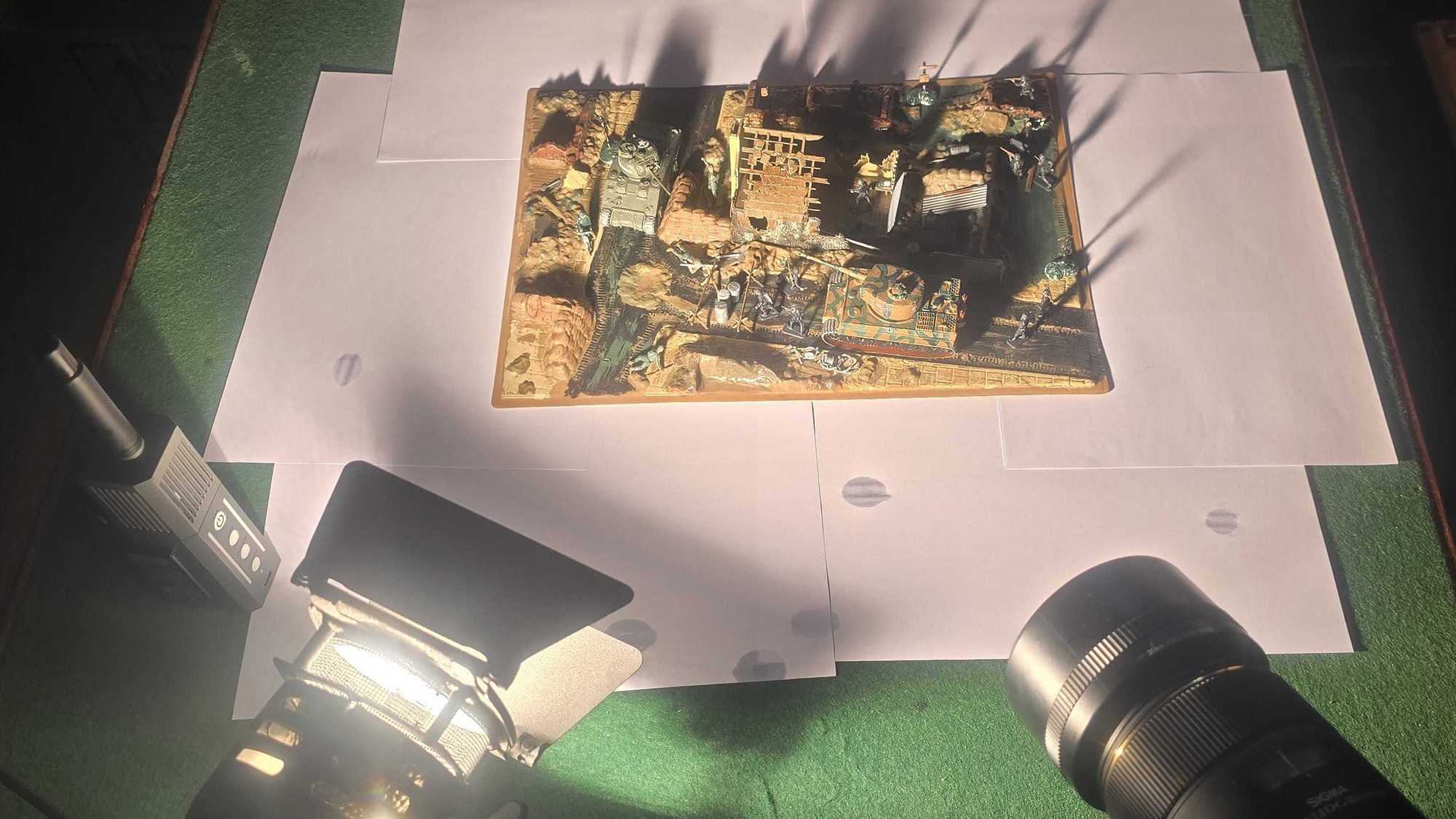 Video light, camera and smoke machine in front of the 1:76 scale model set