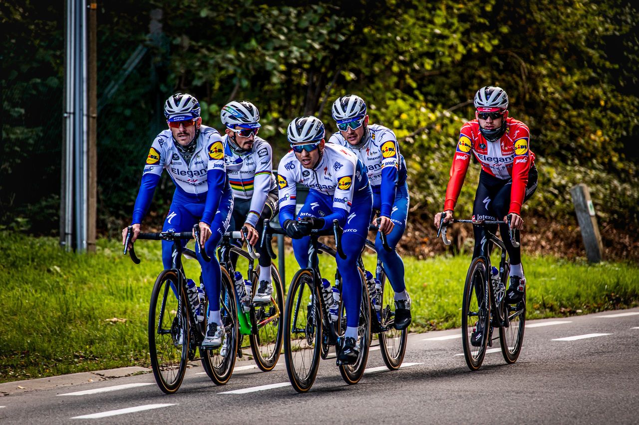 The team takes stock on one of the wide road sections