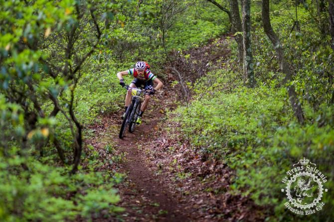 Colt McElwaine corners in a new loamy section of tr ail of Stage 6