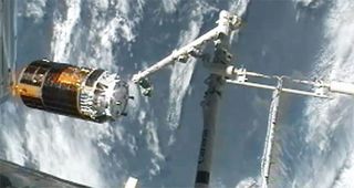 Japan's HTV-3 robotic cargo ship leaves the International Space Station on Sept. 12, 2012, after being released from the station's robotic arm. Astronauts inside the station used the arm to detach the HTV-3 cargo ship from the station and set it free in space to end its mission.