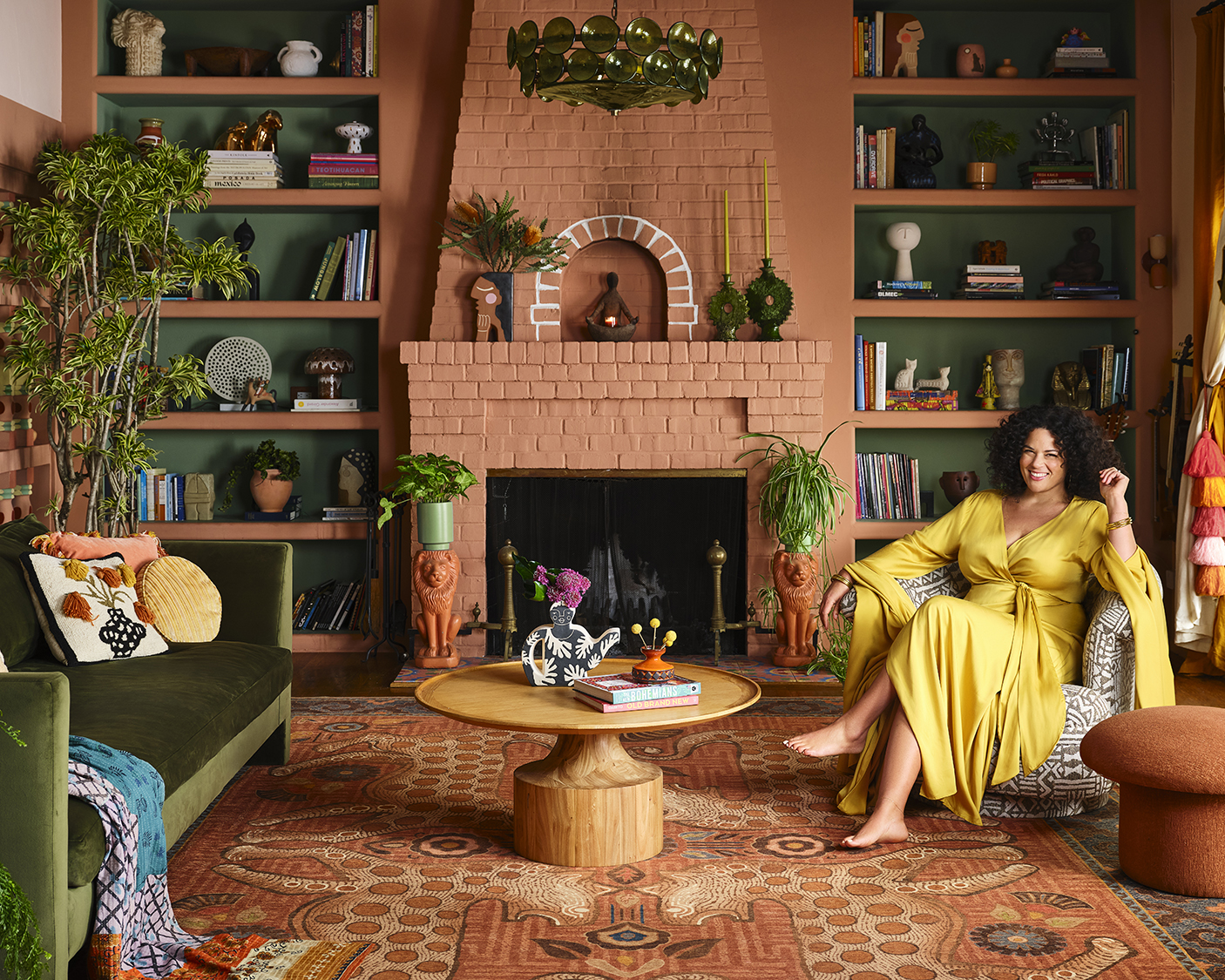 justina blakeney in a terracotta living room with a large rug on the floor
