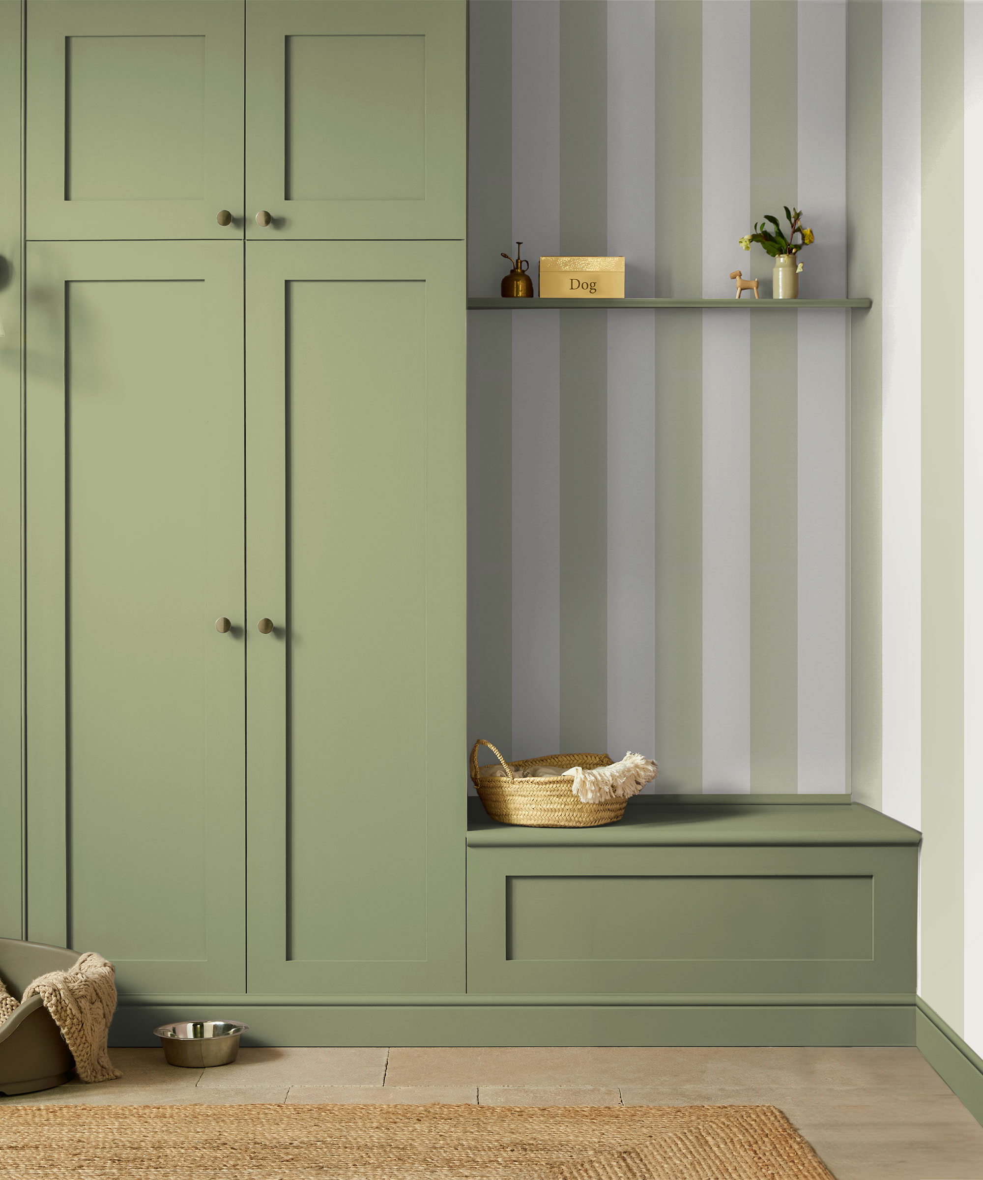 fitted green boot room with green and white stripe wallpaper