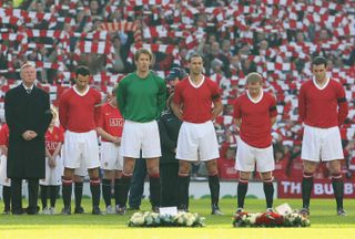 Manchester United players line up in a special kit to mark the 50th anniversary of the Munich disaster in a derby against Manchester City in February 2008.