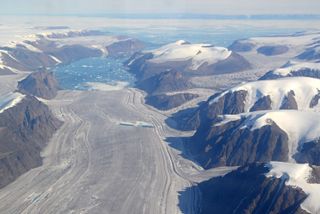 A marine ice shelf on the eastern edge of the Prince of Wales ice field, east central Ellesmere Island, Nunavut, Canada, produces icebergs and ponds of meltwater. Icebergs that break off of these ice shelves may eventually drift south into Baffin Bay.