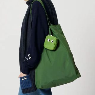 green tote bag with embroidered eye design