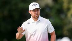 Xander Schauffele waves to the crowd