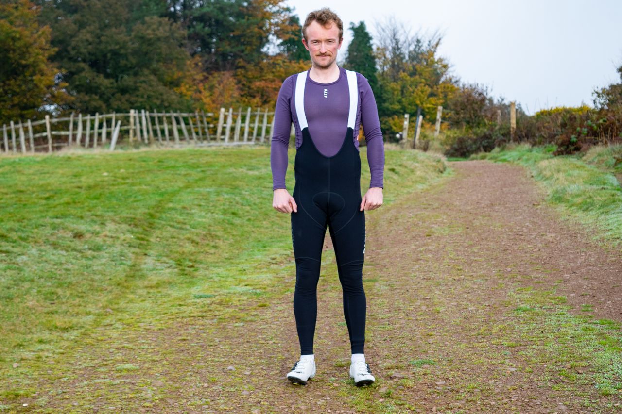 A man wearing a pair of Rapha Pro Team Winter bibtights