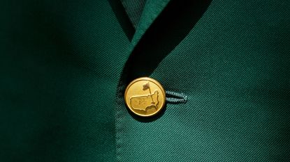 Most wins at The Masters quiz image - button with Augusta National logo on an Augusta National Green Jacket 