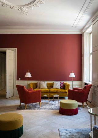 a living room with red walls