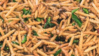 Close up of fried larvae in a night market.