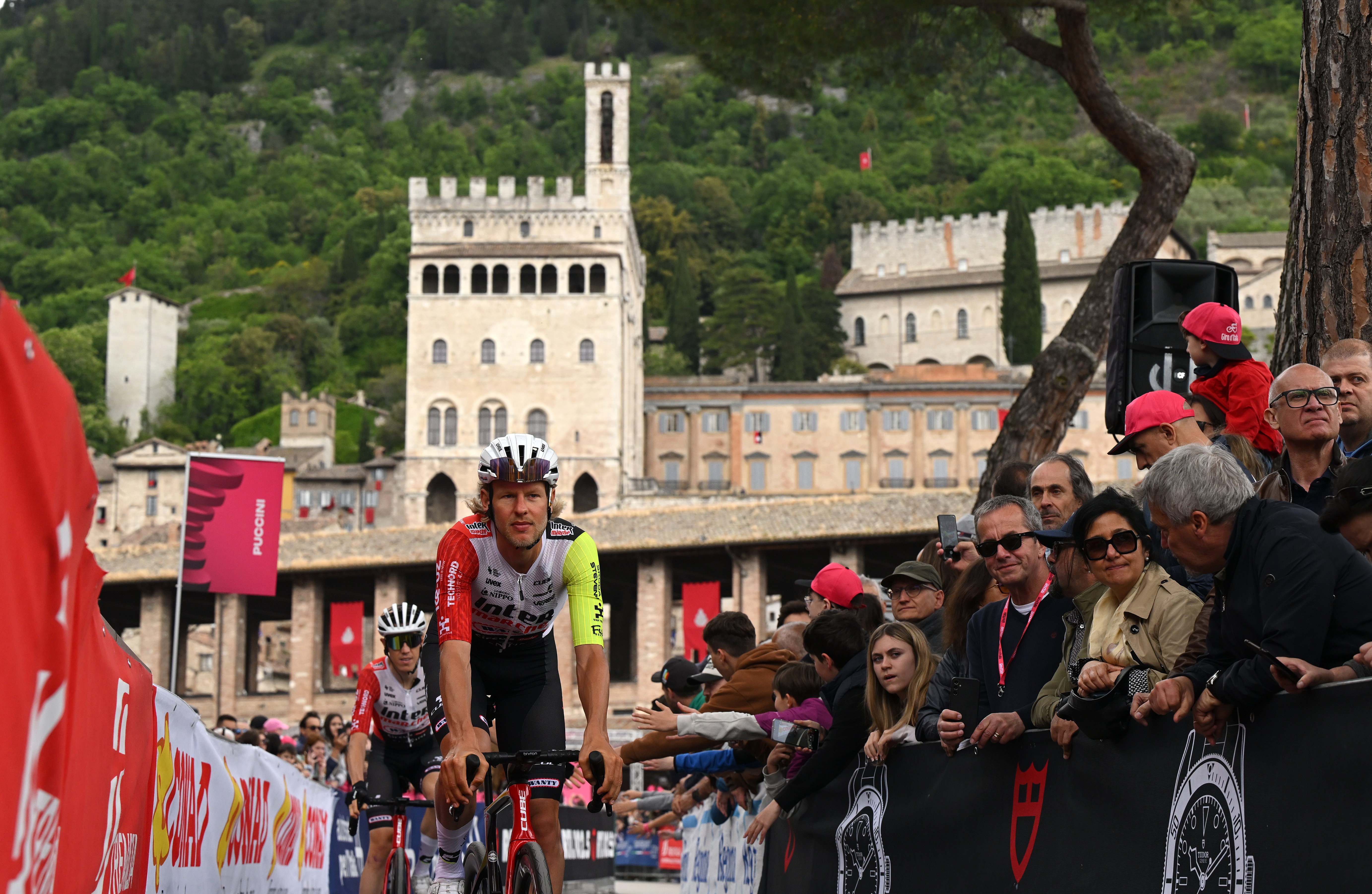 Taco van der Hoorn rides his bike in front of a palazzo