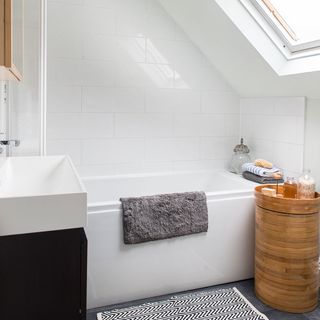 Bathroom with attic wall