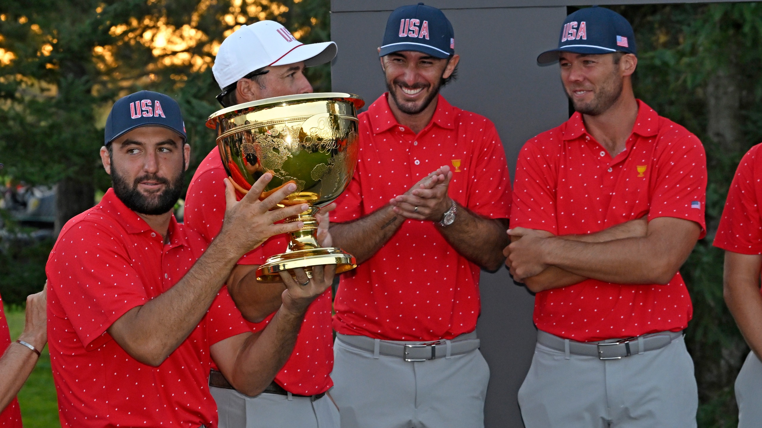 Scottie Scheffler lifts the Presidents Cup trophy after the US claimed victory at the Royal Montreal Golf Club in 2024.