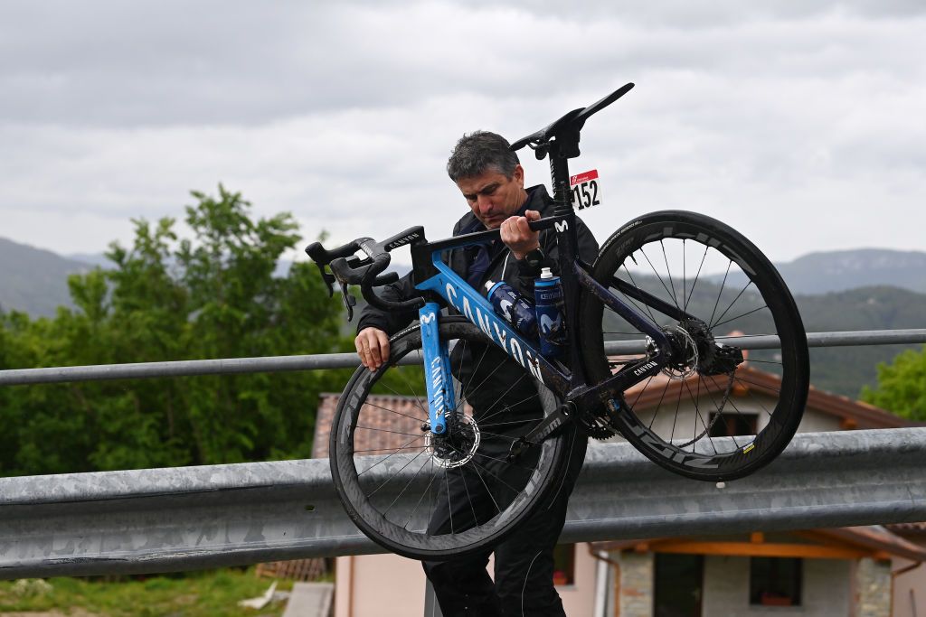 VIAREGGIO ITALY MAY 16 A mechanic holds the Canyon bike of Will Barta of The United States and Movistar Team during the 106th Giro dItalia 2023 Stage 10 a 196km stage from Scandiano to Viareggio UCIWT on May 16 2023 in Viareggio Italy Photo by Tim de WaeleGetty Images