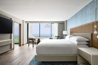 an image of VEA hotel room with bed and sea view