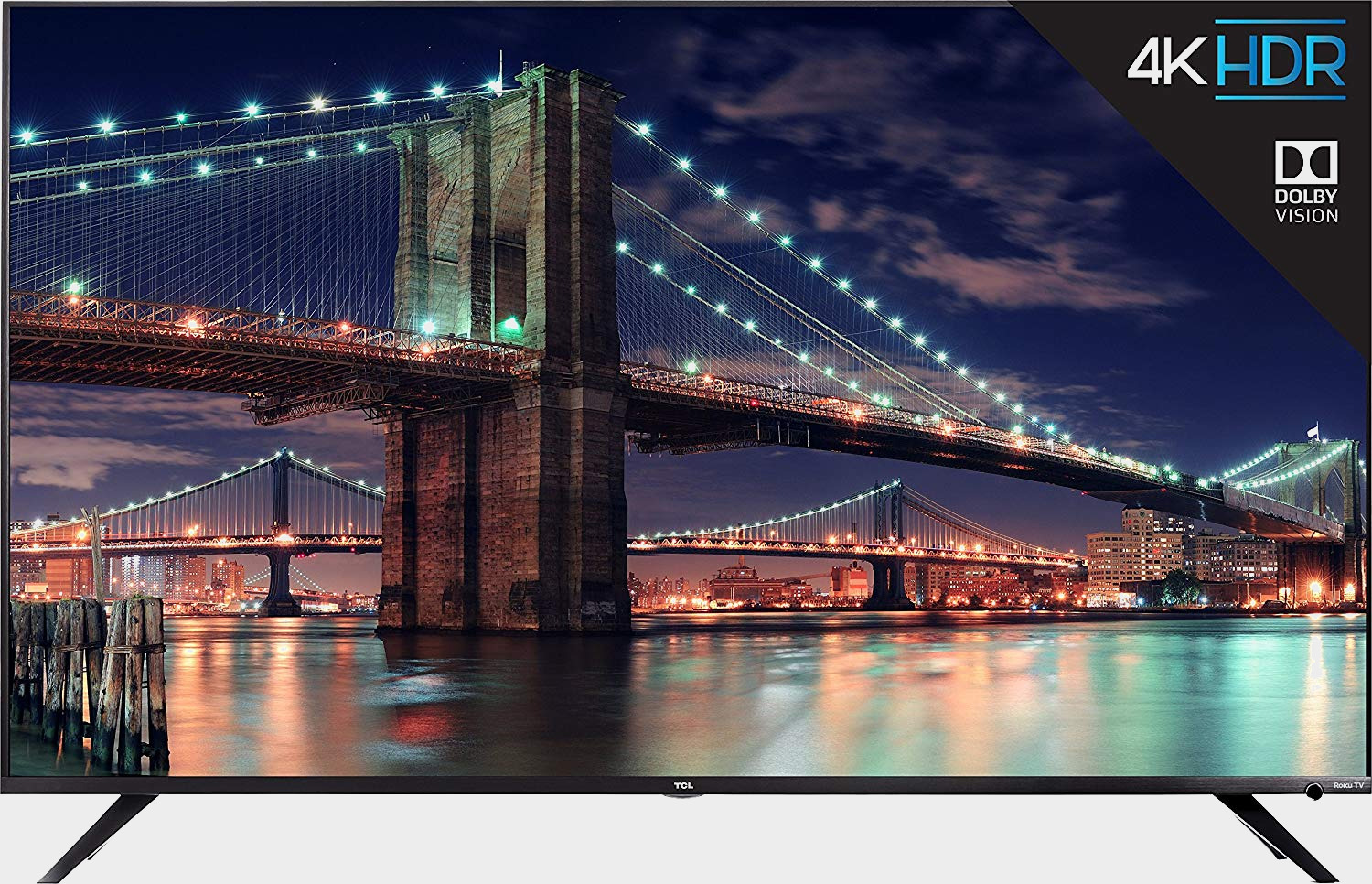 TCL 55R617 Roku TV on a grey background with road bridges on the screen