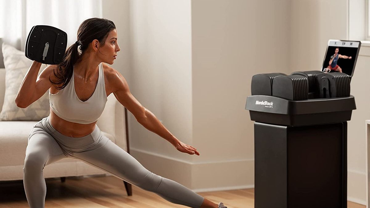 a photo of a woman using the NordicTrack iSelect Adjustable Dumbbells