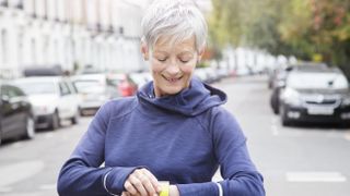 Woman looking at fitness tracker on wrist