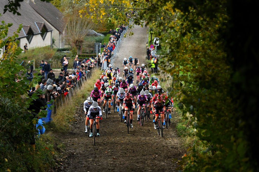 OUDENAARDE BELGIUM NOVEMBER 01 LR Hlne Clauzel of France and As Bike Cross Team Lucinda Brand of The Netherlands and Team Baloise Trek Lions Ceylin Del Carmen Alvarado of The Netherlands and Team Alpecin Fenix Fem Van Empel of The Netherlands and Team Pauwels Sauzen Bingoal Alicia Franck of Belgium and Team Proximus Alphamotorhomes Doltcini Ct Denise Betsema of The Netherlands and Team Pauwels Sauzen Bingoal Annemarie Worst of The Netherlands and Team 777 and Blanka Vas Kata of Hungary Team SD Worx lead The Peloton at race start during the 32nd Koppenbergcross Grand Prix Jolien Verschueren 2021 Womens Elite Koppenbergcross Oudenaarde X2OBadkamersTrofee on November 01 2021 in Oudenaarde Belgium Photo by Luc ClaessenGetty Images