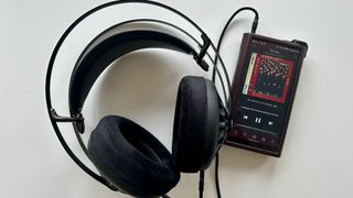 Meze Audio 105 AER headphones in a hi-fi testing room, on gray background