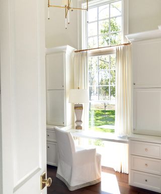 white traditional dressing room with large window