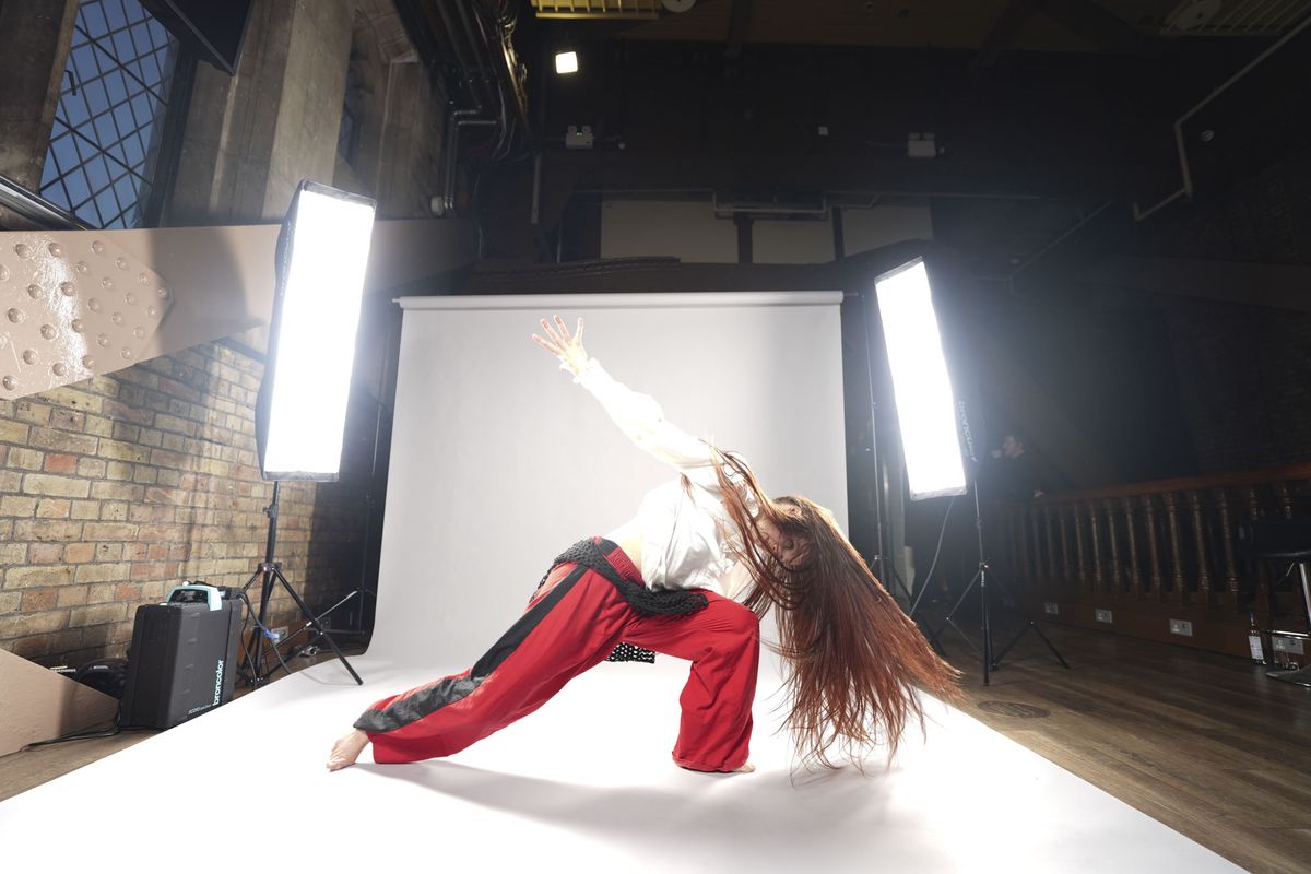 Sony A7 V sample images &ndash; dancer's movement frozen, with background roll and lights included in the frame