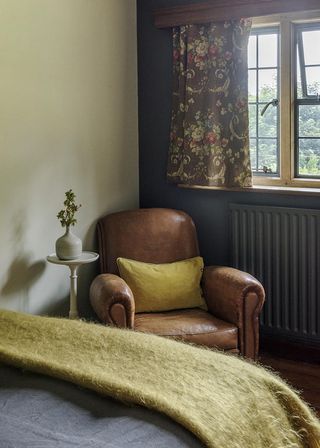 bedroom with leather armchair with cushion