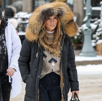 Jennifer Lopez was seen making her way through heavy snow on Christmas Day to dine at the White House restaurant in Aspen wearing fur yeti boots and a lady dior bag