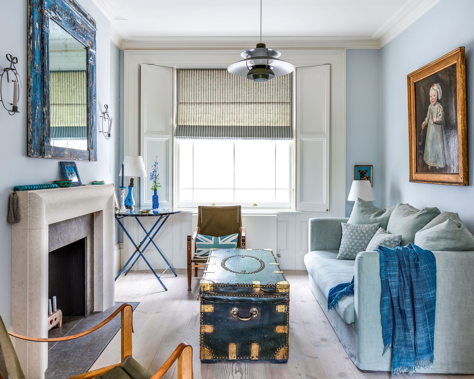 Blue living room with blue sofa, coffee table and side table