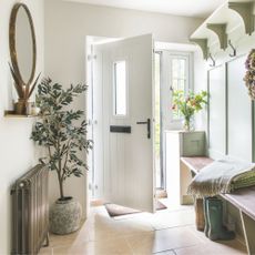 Cottage hallway with autumnal decor throughout