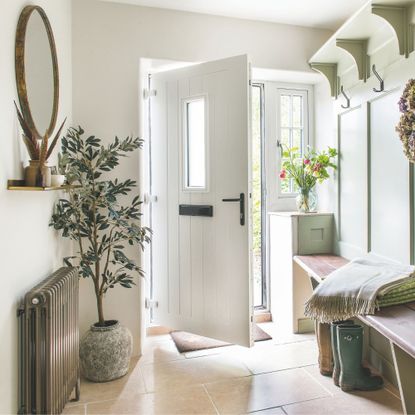 Cottage hallway with autumnal decor throughout