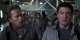 Arnold Schwarzenegger and Sylvester Stallone in Escape plam