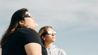 Women watching the eclipse