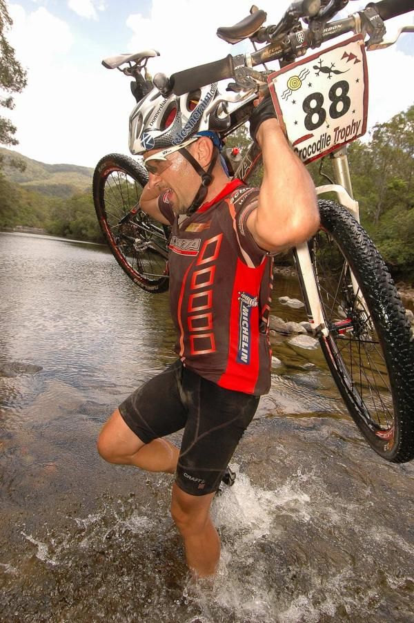 Erich Reith carries his bike