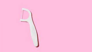 floss on pink background