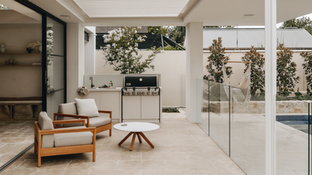 A backyard patio with outdoor seating area