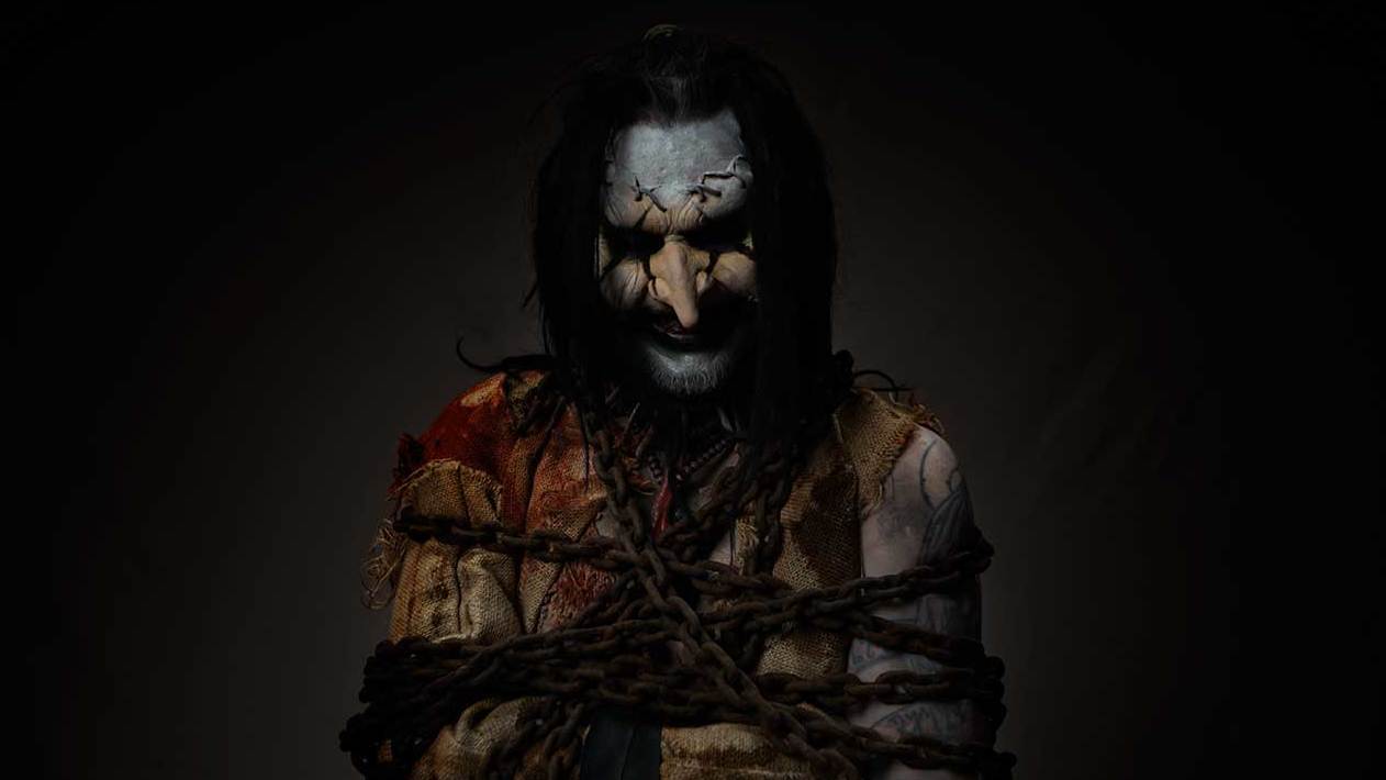 Mortiis wrapped up in chains