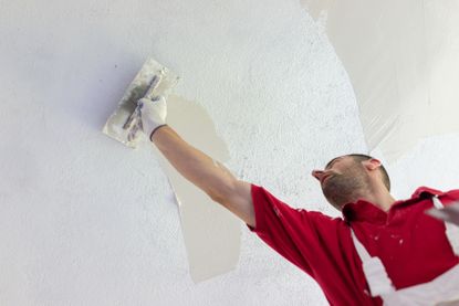 Plastering a ceiling