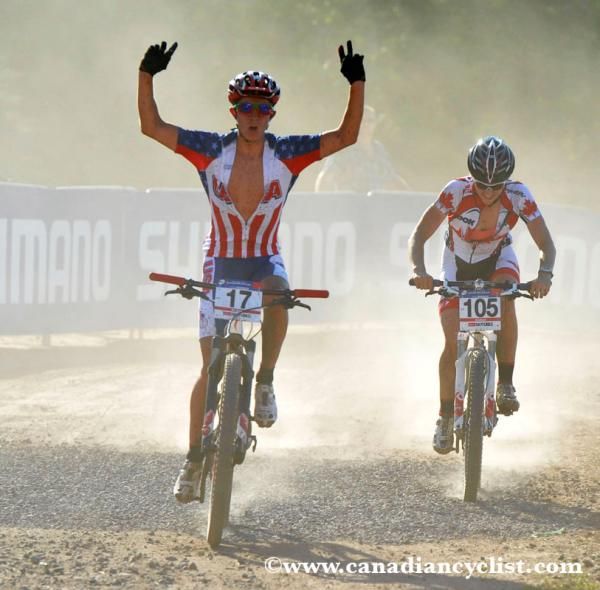 Howard Grotts (USA) wins... in a cloud of dust.